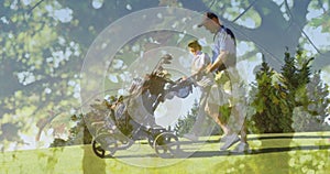 Animation of glowing light over happy senior couple walking on golf course