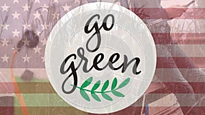 Animation of go green text and logo over flag of america and man using phone in countryside