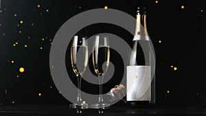 Animation of golden dots over champagne and glasse on black background