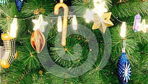 Animation golden ribbon falls from top to bottom. With green Christmas tree branches.