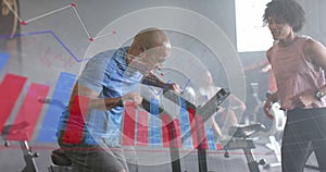 Animation of graph processing data over diverse female trainer and man on elliptical at gym