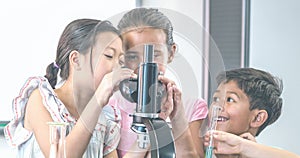 Animation of a group of happy schoolchildren using microscope in science class