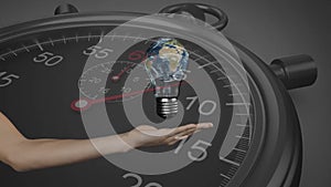 Animation of hand with light bulb and planet earth over stopwatch ticking on black background