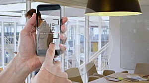 Animation of hands of caucasian man with smartphone with qr code over businessman in office