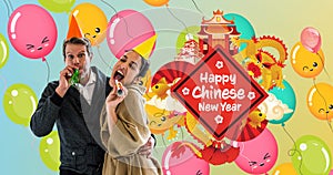 Animation of happy chinese new year text in over couple partying and balloons in background