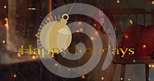 Animation of happy holiday text and swinging bauble over unoccupied chair with santa bag