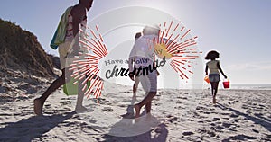 Animation of have a holly jolly christmas over happy african american family walking on beach