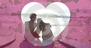 Animation of heart cut out over diverse couple in love on beach in summer