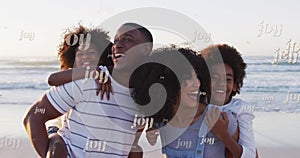 Animation of joy text repeated over happy african american family on sunny beach at christmas time