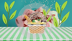 Animation of leaves appearing over basket with food and cupcake