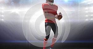Animation of male american football player holding ball at floodlit stadium