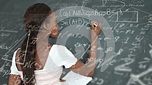 Animation of mathematical equations over female student writing on blackboard