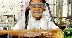 Animation of mathematical formulae over smiling schoolgirl