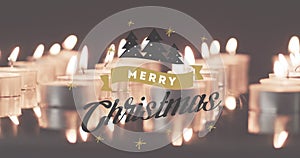 Animation of merry christmas text over lit tea candles background