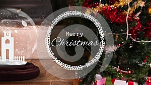 Animation of merry christmas in wreath, church in crystal ball over fireplace and christmas tree