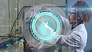 Animation of moving clock over african american female scientist working in lab