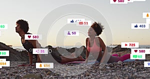 Animation of multiple notification bars over diverse couple doing yoga at beach