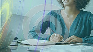 Animation of neon abstract shapes, light trails over african american woman taking notes at office