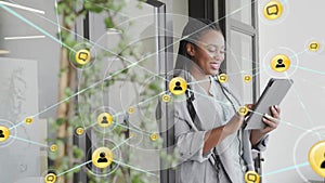 Animation of network of connections with icons over african american woman using tablet