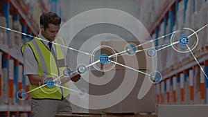 Animation of network of connections with icons over man working in warehouse