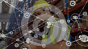Animation of network of connections with people icons over caucasian man working in warehouse
