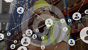 Animation of network of connections with people icons over caucasian man working in warehouse