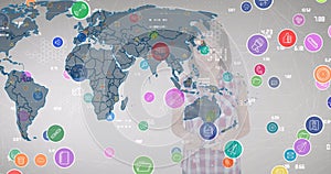 Animation of network of digital icons over world map against caucasian girl using smartphone