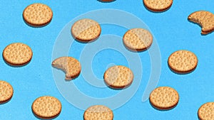 Animation. Pop art with cookies over violet background flat lay top-down composition. Confectionery product food pattern