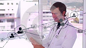 Animation of profile icons interconnecting with lines over caucasian doctor using digital tablet