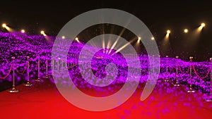 Animation of purple particles moving over red carpet venue with spotlights