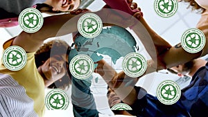 Animation of recycling green signs and globe over diverse friends holding hands