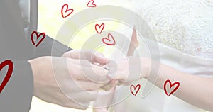 Animation of red hearts over caucasian couple wearing rings