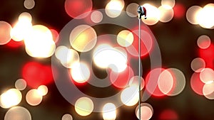 Animation of rerto microphone with santa hat over shining bokeh