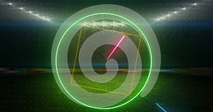 Animation of rotating neon shapes and lights over floodlit sports field