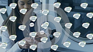 Animation of save energy text with speech bubble and tree icons over biracial woman doing laundry