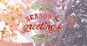 Animation of seasons greetings text over fir trees