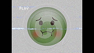 Animation of sick emoji icon over play screen with disturbance