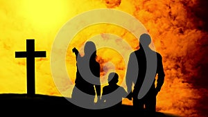 Animation of a silhouettes of Christian cross and a family with one child over yellow clouds moving