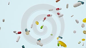 Animation slow motion flying, falling pills. Colored tablets, capsules. Health care concept. Antibiotics inside pills