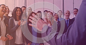 Animation of smiling group of diverse business people clapping at meeting