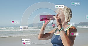 Animation of social media data processing over caucasian drinking during exercis on beach