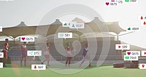 Animation of social media notifications over diverse male hockey players playing match in sun