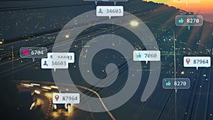 Animation of social media notifications over fast motion traffic on road and city lights at sunset