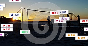 Animation of social media notifications over silhouetted female volleyball players at sunset