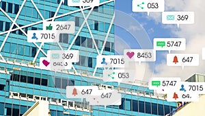 Animation of social networking notifications moving over modern city buildings