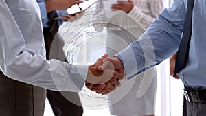 Animation of spinning connections over businessman handshake