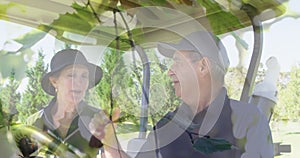 Animation of trees over senior caucasian couple on golf course