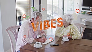 Animation of vibes text in orange over happy senior caucasian couple with coffee talking at home