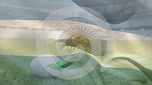 Animation of waving flag of argentina over stadium with rugby ball