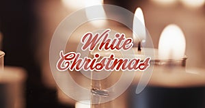 Animation of white christmas text over lit candles background